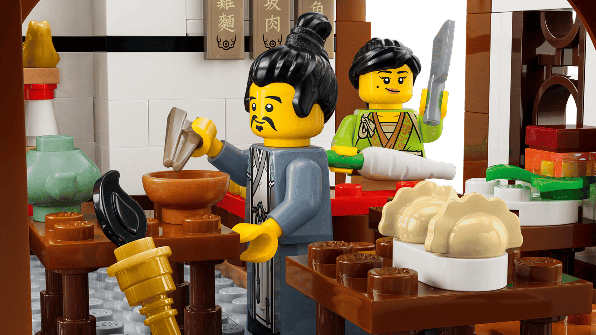 LEGO figures in a kitchen setting with various kitchen items and utensils.