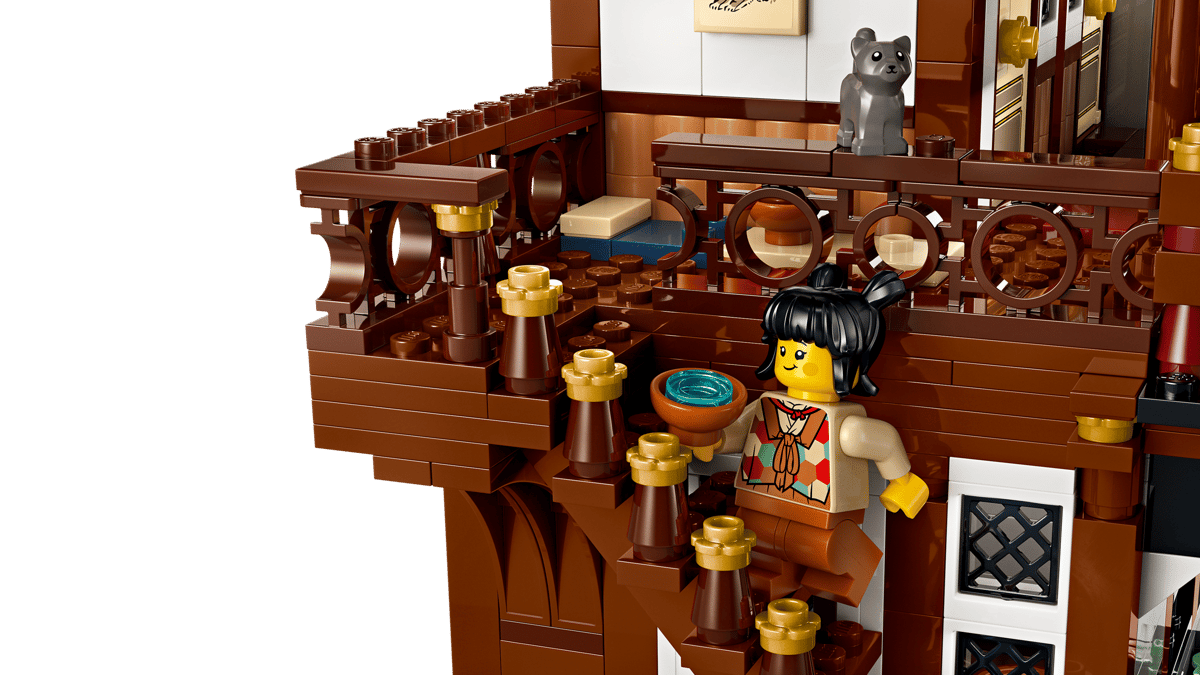 LEGO model of a traditional Chinese teahouse with a teapot and teacup.