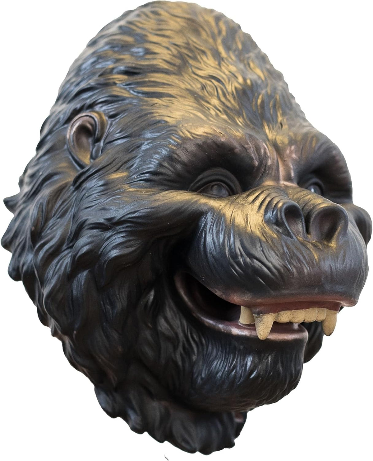 A realistic gorilla puppet with textured dark brown and black fur, featuring a wide-open mouth showing small yellowish teeth, isolated on a white background.