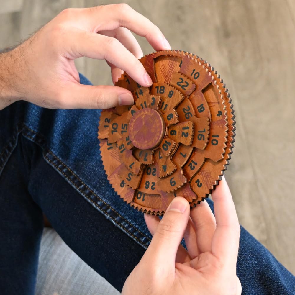 Wooden gear puzzle held by a person against a neutral background