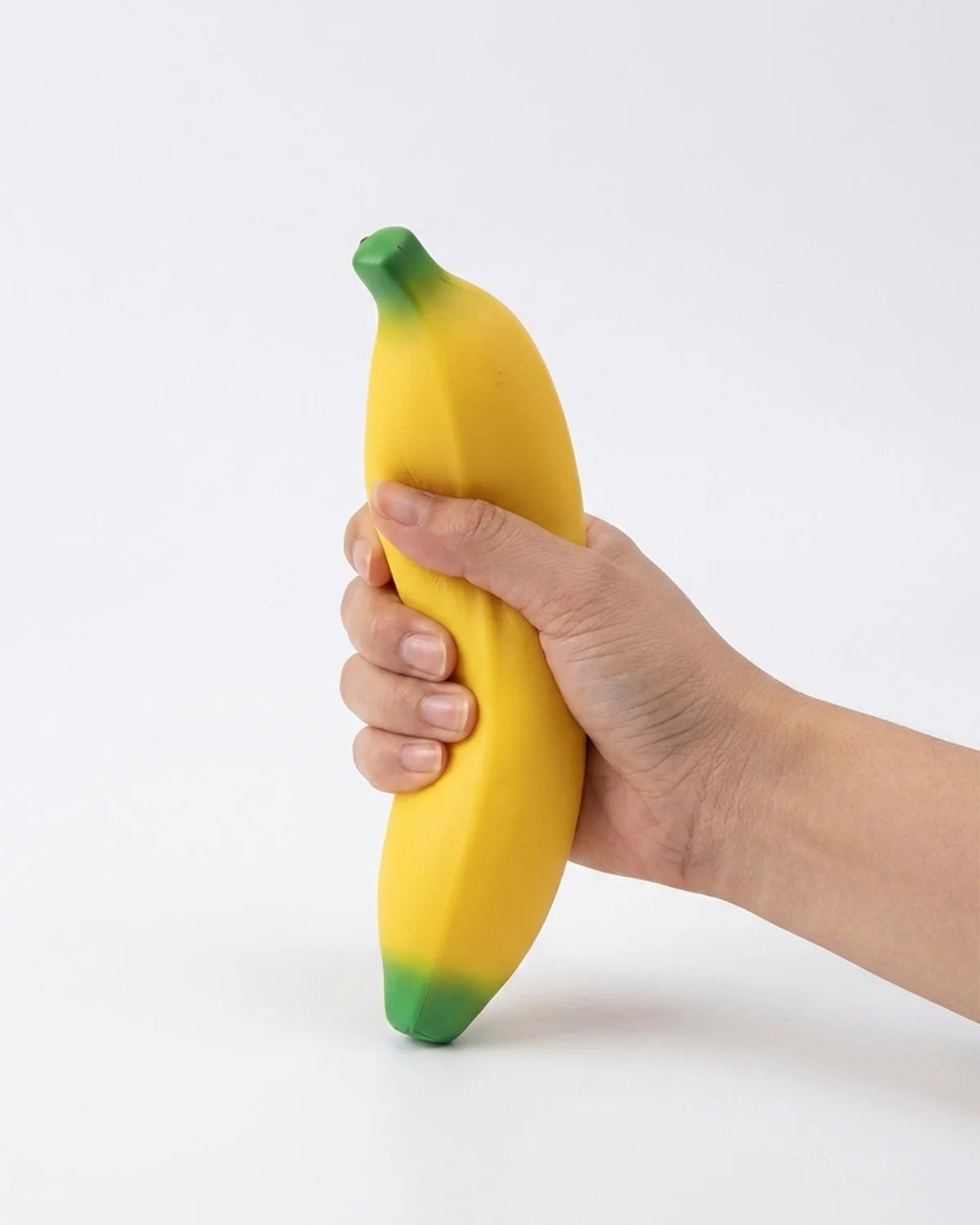 The Voodle Banana Squishy is a fun, realistic fruit squishy toy designed for satisfying stress relief and sensory play. This soft banana stress ball is perfect for squeezing during work, school, or at home to help reduce anxiety and promote relaxation. With its bright yellow color and smooth, slow-rebound texture, this banana squishy makes an eye-catching desk toy, party bag filler, or novelty gift for kids and adults who love kawaii squishies and fruity fidget toys.